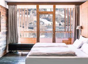 Dachstein Suite - dachstein-suite-bett-1920x1080