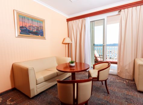 Grand Hotel Portorož Superior - grand-hotel-portoroz-living-room-chairs-couch-sea-view-balcony